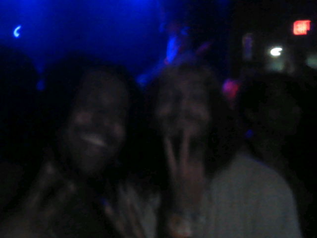 sabi and the bassist of awannabe smiling and doing peace signs at the 3ds camera
